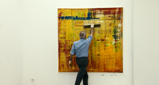 Gerhard Richter working on "Abstract Painting (910-1)"