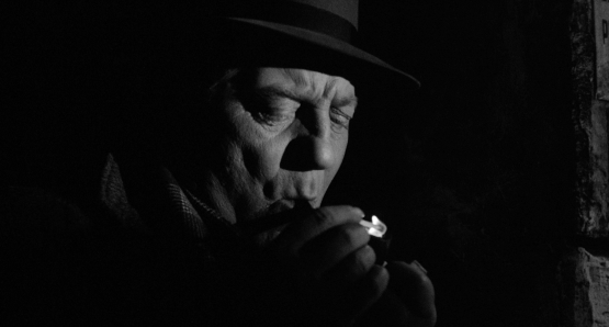 Maigret lights up in MAIGRET AND THE ST. FIACRE CASE.