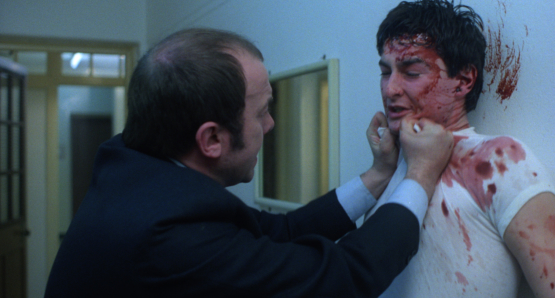 John Judd as Sands, one of the screws, and a bloodied John Blundell as Pongo in Alan Clarke's SCUM
