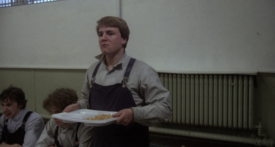 Ray Winstone, as Carlin, readies for a fight in Alan Clarke's SCUM