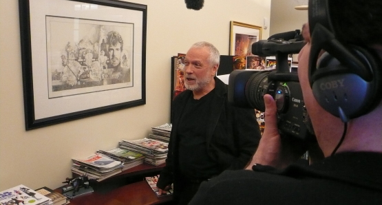Drew Struzan observing his artwork at Lucasfilm Studios on the set of DREW: THE MAN BEHIND THE POSTER.