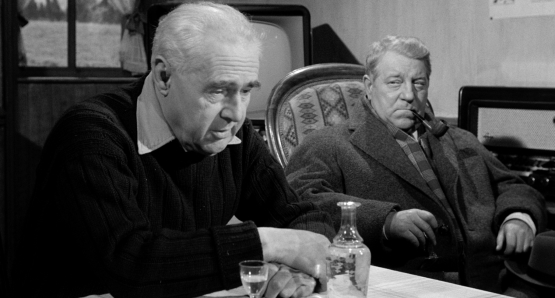 Jean Gabin, as Inspector Jules Maigret, questions Gaulthier (Camille Guérini) in MAIGRET AND THE ST. FIACRE CASE.